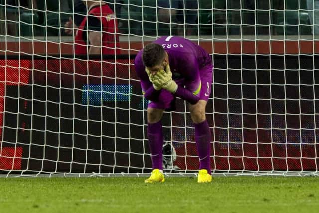 Celtic goalkeeper Fraser Forster shows his despair after conceding Legia Warsaws fourth goal. Picture: SNS