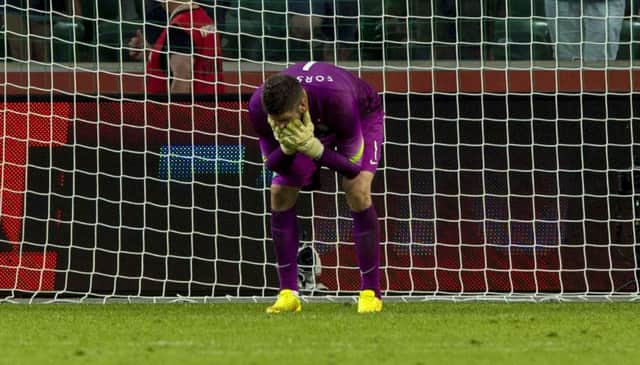 Celtic goalkeeper Fraser Forster shows his despair after conceding Legia Warsaws fourth goal. Picture: SNS