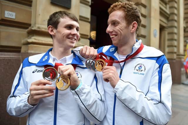 Scottish swimmers Ross Murdoch, 20, from Balfron (L) and Daniel Wallace, 21