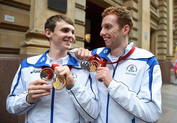Scottish swimmers Ross Murdoch, 20, from Balfron (L) and Daniel Wallace, 21