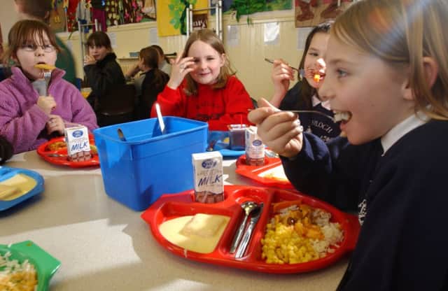 Budget cuts of £6bn will have an impact on the future of initiatives such as free school meals for children in primary 1-3. Picture: Phil Wilkinson