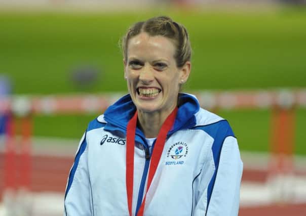 Eilidh Child grins broadly after winning a silver last night. Picture: Jane Barlow