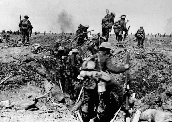 British troops negotiating a trench as they go forward in support of an attack on the village of Morval during the Battle of the Somme. Picture: PA
