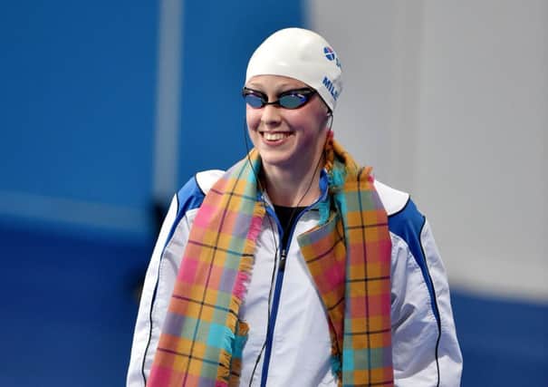 Englishborn, Inverurieraised Hannah Miley proudly wears her tartan scarf as she is introduced at the Tollcross Swimming Centre Picture: Ian Rutherford