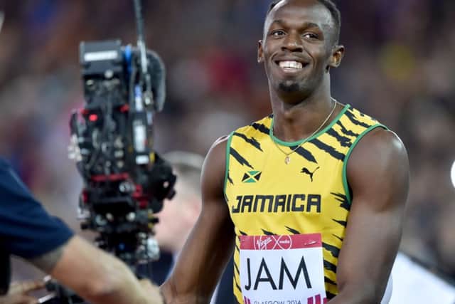 Usian Bolt running the anchor leg for Jamaica. Picture: Ian Rutherford