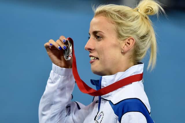 Lynsey Sharp celebrates with her silver medal. Picture: Ian Rutherford
