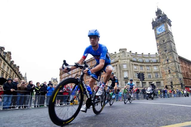 David Millar makes his way down High Street past the famous Tolbooth Steeple. Picture: SNS