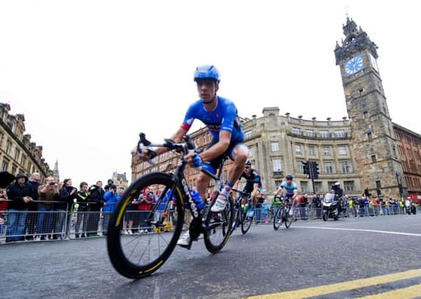 David Millar makes his way down High Street past the famous Tolbooth Steeple. Picture: SNS