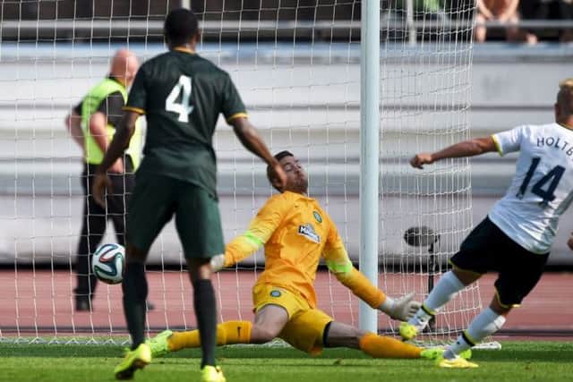 Tottenham Hotspur's Lewis Holtby scores against Celtic keeper Craig Gordon. Picture: Reuters