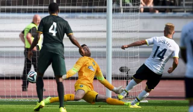 Tottenham Hotspur's Lewis Holtby scores against Celtic keeper Craig Gordon. Picture: Reuters