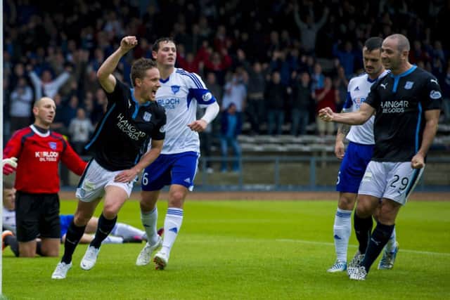 Dundee's Simon Ferry celebrates his opening goal. Picture: SNS