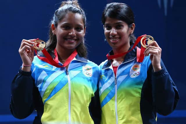 Dipika Pallikal and Joshana Chinappa of India celebrate with their Gold medals. Picture: Getty