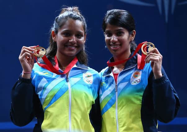 Dipika Pallikal and Joshana Chinappa of India celebrate with their Gold medals. Picture: Getty