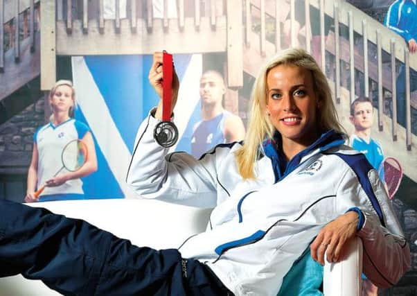 Lynsey Sharp shows off her medal at Scotland House in Glasgow. Picture: PA