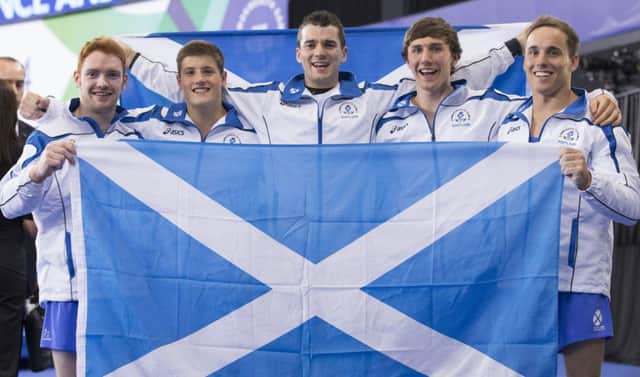 Scotland's gymnasts celebrate their medal wins. Picture: PA