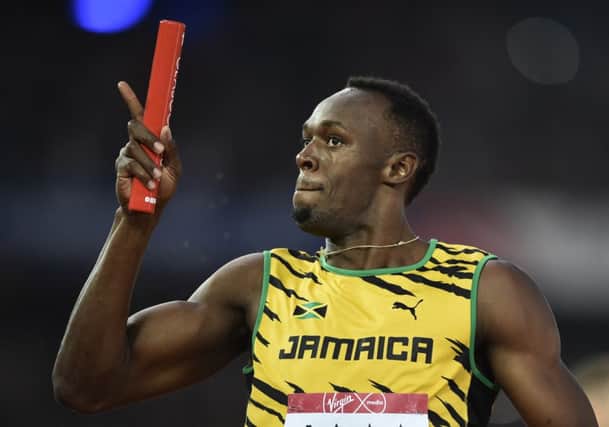 Usain Bolt wins the final of the men's 4 x 100m relay at Hampden. Picture: AFP/Getty