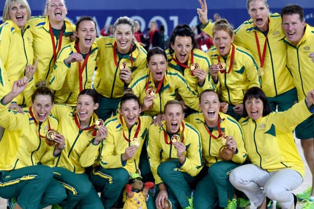 Australia celebrate beating New Zealand to win gold in the Netball. Picture: Jane Barlow