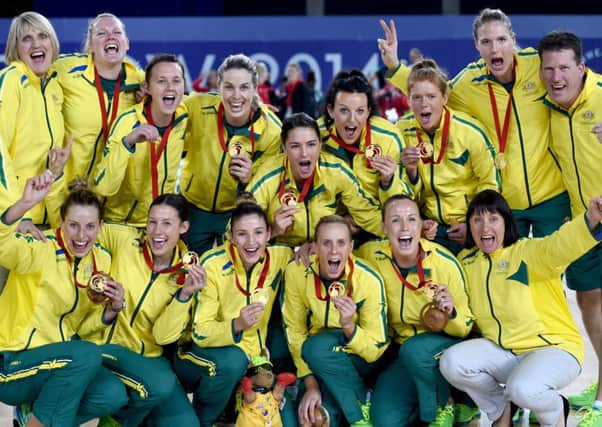 Australia celebrate beating New Zealand to win gold in the Netball. Picture: Jane Barlow