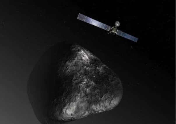 A nottoscale artists image gives an impression of the 28metre probe and the 4kmwide comet. Picture: Contributed