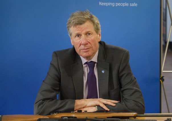 Justice Minister Kenny MacAskill highlights the healthy numbers in comparison to England and Wales. Picture: Steven Scott Taylor.