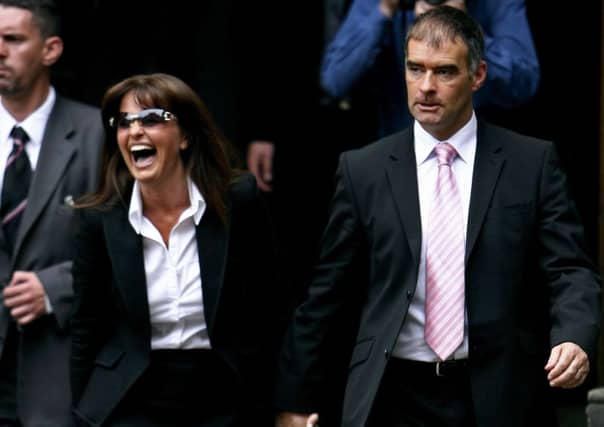 Tommy Sheridan with his wife Gail outside court after he won his defamation case Picture: Getty Images
