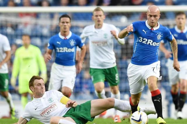 Liam Craig attempts to tackle Nicky Law during Tuesdays closely-contested Petrofac Training Cup tie at Ibrox. Picture: Craig Williamson/SNS