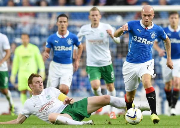 Liam Craig attempts to tackle Nicky Law during Tuesdays closely-contested Petrofac Training Cup tie at Ibrox. Picture: Craig Williamson/SNS