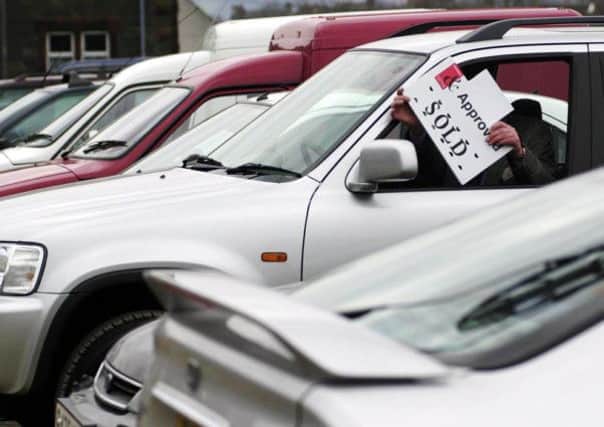 Across the UK, sales are now projected to top 2.45 million vehicles in 2014, an 8.1 per cent rise on last year. Picture: AP