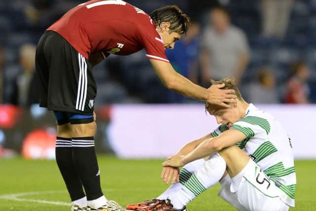 Ivica Vrdoljak consoles Stefan Johansen after Celtic's 6-1 aggregate defeat. Picture: SNS