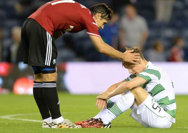 Ivica Vrdoljak consoles Stefan Johansen after Celtic's 6-1 aggregate defeat. Picture: SNS