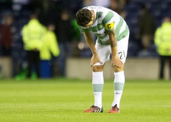 Charlie Mulgrew looks dejected after the Champions League qualifier. Picture: PA