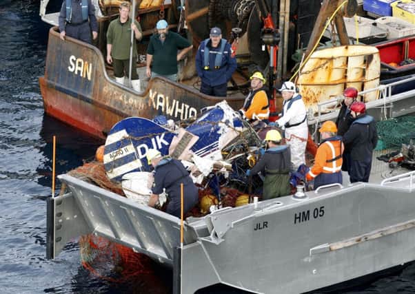 The plane's wreckage is lifted out of the water. Picture: AP