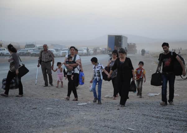 Christians flee the Mosul area as Islamic State militants continue their advance in all directions through Iraq. Picture: Getty Images