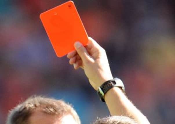 The referee was allegedly punched after administering a red card. Picture: Ian Rutherford