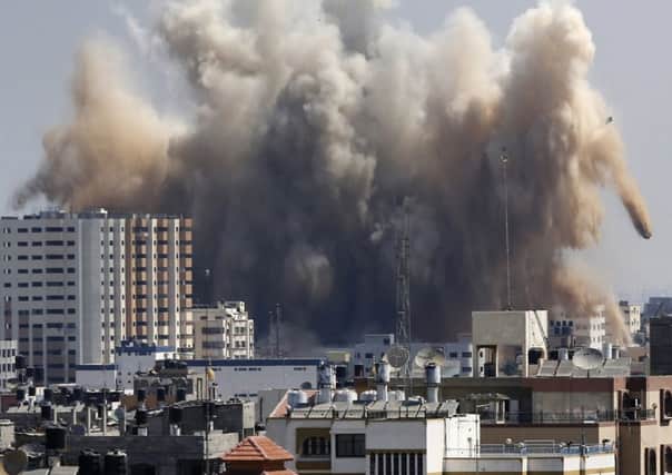 An explosion rocks Gaza City yesterday after Israel launched air strikes in the wake of Egyptianled talks breaking down. Picture: AP