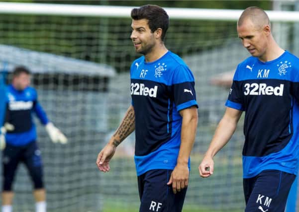 Richard Foster, centre, trains with Kenny Miller. Picture: SNS