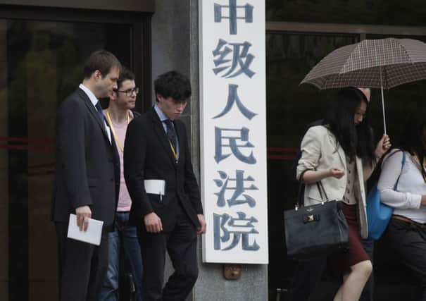 Harvey Humphrey (3rd L), the son of Peter Humphrey and Yu Yingzeng, leaves the Shanghai No.1 Intermediate People's Court. Picture: Getty