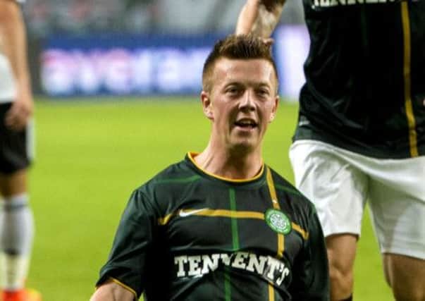 Callum McGregor slides in celebration of opening the scoring for Celtic in Warsaw. Picture: SNS