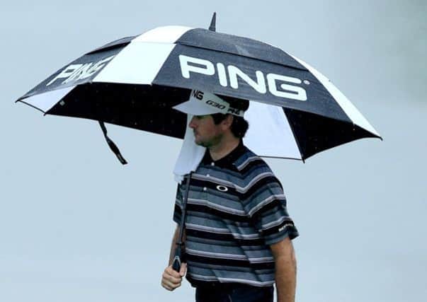 Bubba Watson walks under an umbrella on the 18th hole during the second round of the 96th PGA Championship at Valhalla Picture: Getty