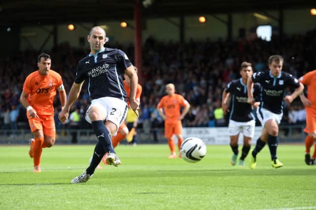 Gary Harkins opens the scoring for Dundee. Picture: SNS