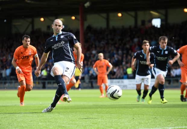 Gary Harkins opens the scoring for Dundee. Picture: SNS