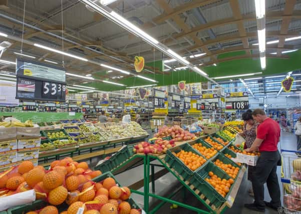 Customers look at shelves with imported fruit and vegetables at a supermarket in Novosibirsk, Russia. Picture: AP