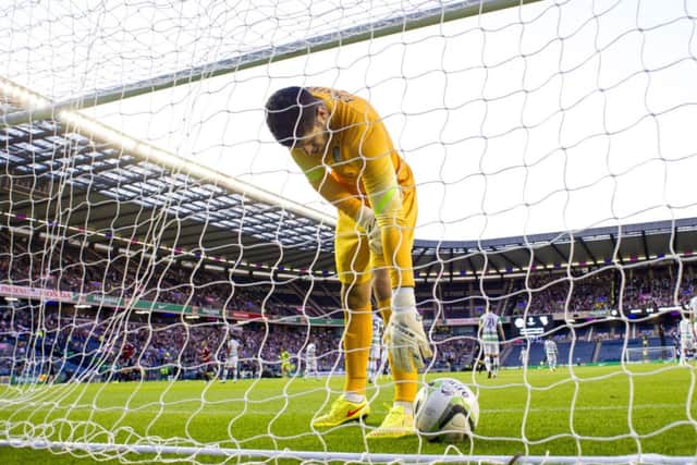 Fraser Forster picks the ball out of the net during Wednesday's Champions League qualifier against Legia Warsaw at Celtic Park. Picture: SNS