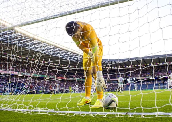 Fraser Forster picks the ball out of the net during Wednesday's Champions League qualifier against Legia Warsaw at Celtic Park. Picture: SNS