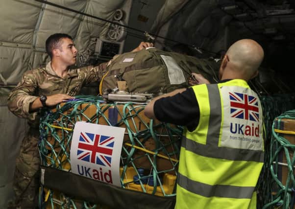 The first UK humanitarian supplies included water and solar lanterns which can be used to recharge mobile phones. Picture: MOD