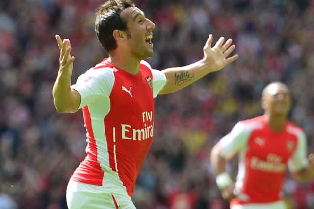 Arsenal's Spanish midfielder Santi Cazorla (L) celebrates scoring the opening goal during the FA Community Shield. Picture: Getty