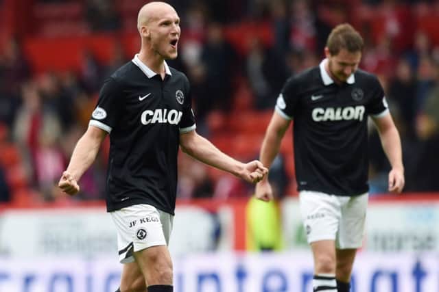 Dundee United's Jaroslaw Fojut celebrates at full-time after his side defeat Abderdeen. Picture: SNS
