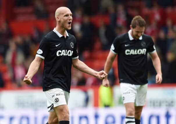 Dundee United's Jaroslaw Fojut celebrates at full-time after his side defeat Abderdeen. Picture: SNS