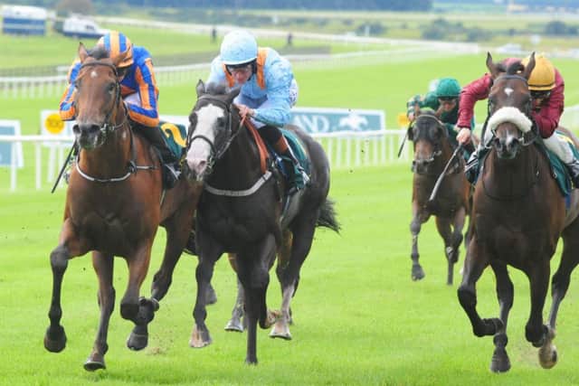 Joseph OBrien rides Dick Whittington, left, to victory by half a length over favourite Kool Kompany in the Keeneland Phoenix Stakes, a race his father, trainer Aidan, has made a habit of winning. Picture: PA