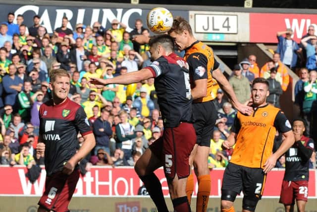 Wolves David Edwards rises above defender Russell Martin to nod home the only goal of the match at Molineux. Picture: Getty